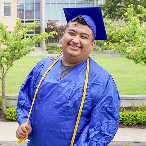 grad wearing blue regalia